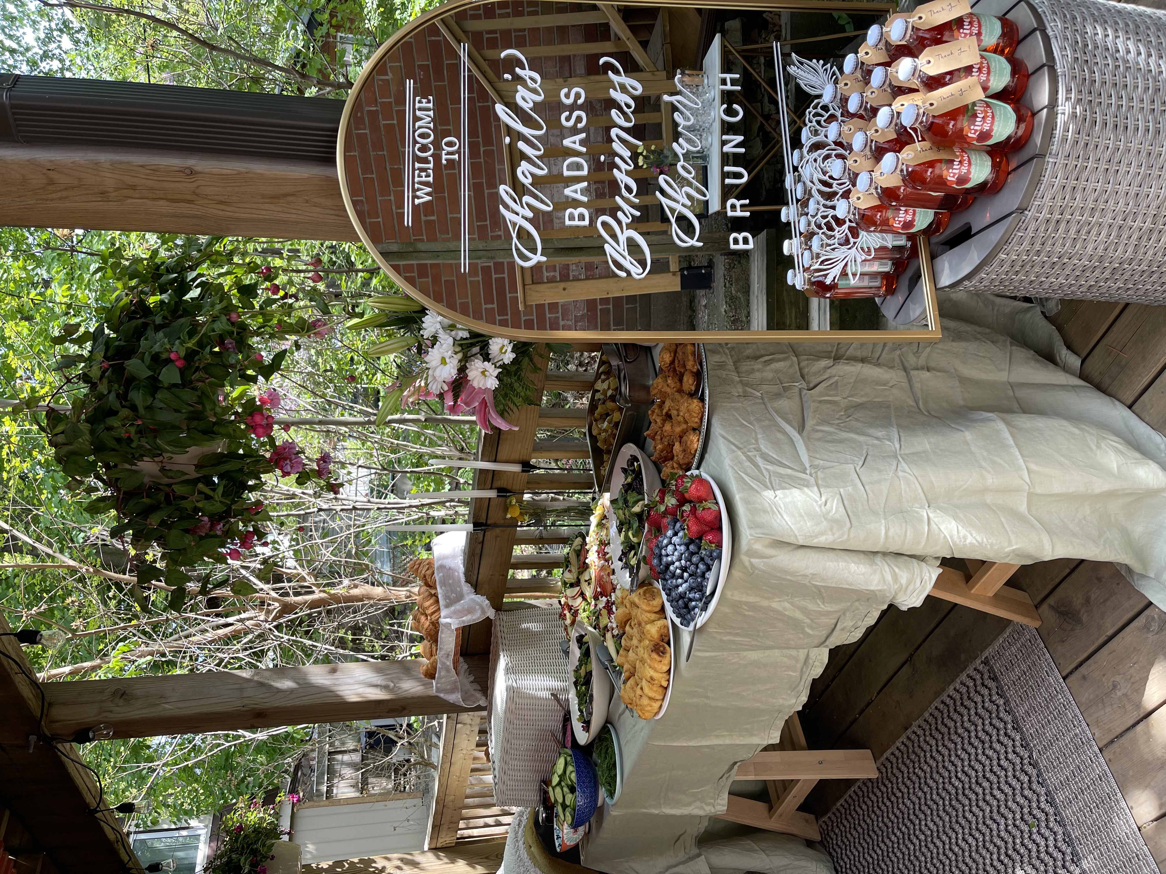 Outdoor calligraphy welcome sign and favour table
